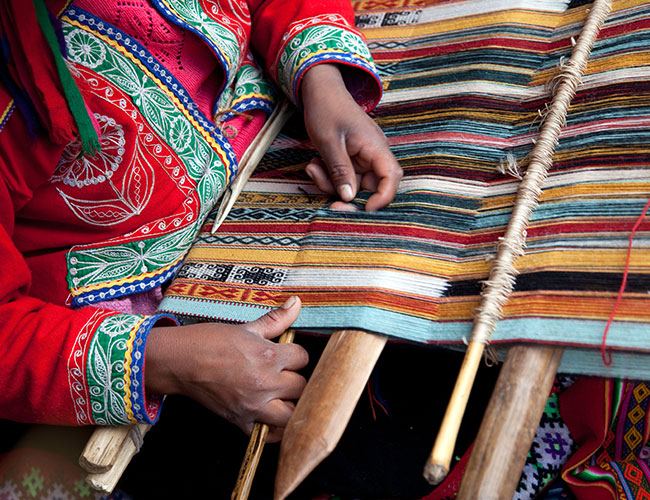 A Lady Artist Weaving Traditional Textile image displayed on the Sanatkada About Us Page