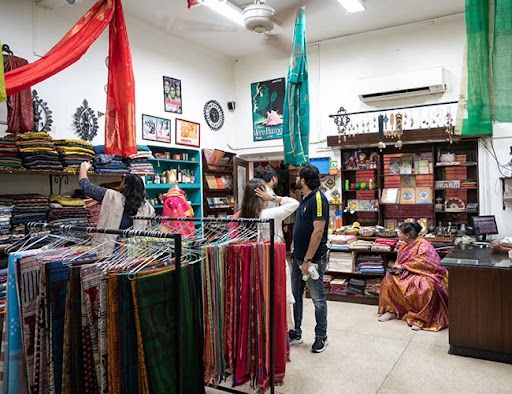 Image of a shop showcasing diverse textile products displayed on the Sanatkada About Us page